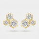 A pair of gold hexagonal stud earrings with round-cut clear gemstones, displayed on a light gray background.