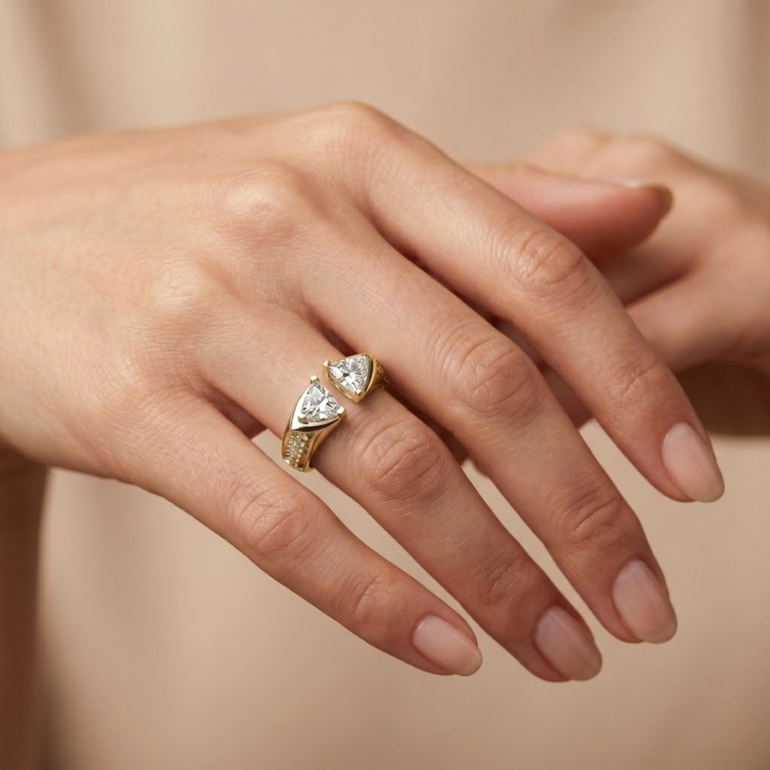 Elegant open triangle moissanite ring featuring two brilliant trillion-cut moissanite stones in a modern bypass open-band design with pavé-set accents on a polished white gold vermeil band, perfect for engagement, promise, stacking, or everyday luxury wear.