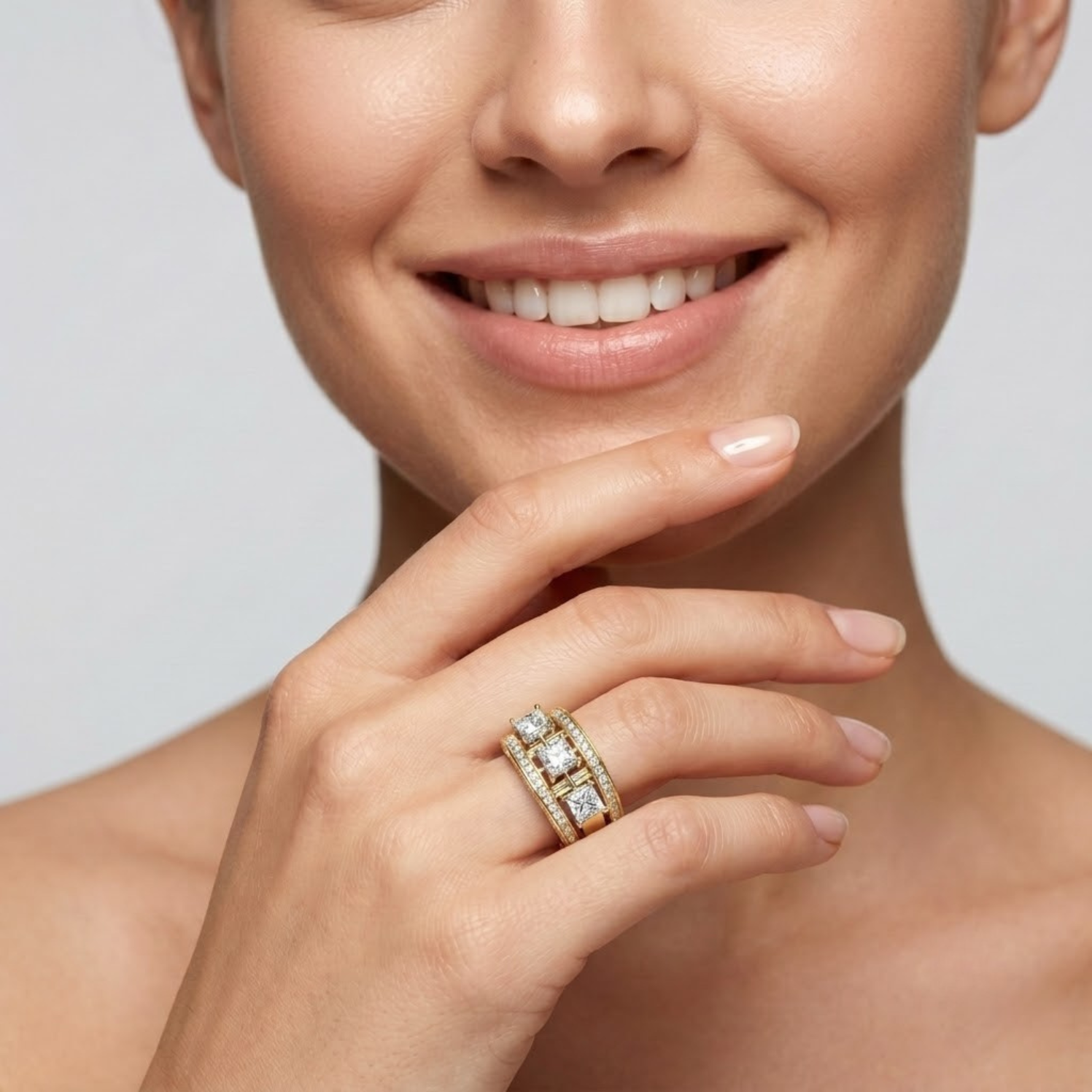 Princess cut moissanite three stone ring with baguette accents, pavé diamonds, and vintage milgrain detailing in 18K gold vermeil.