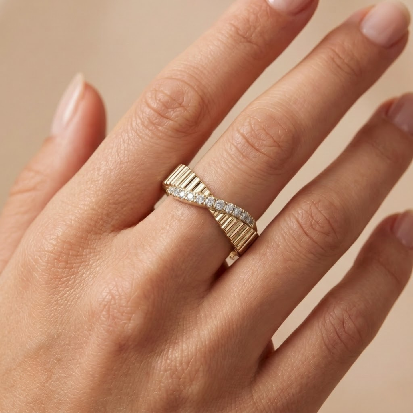 Elegant textured moissanite crossover ring with a ribbed white gold vermeil band featuring a sparkling channel of pavé-set moissanite stones. This modern minimalist statement ring combines geometric texture with refined brilliance, making it perfect for weddings, anniversaries, stacking, everyday wear, or gifting. Crafted with premium moissanite for exceptional fire and lasting elegance.